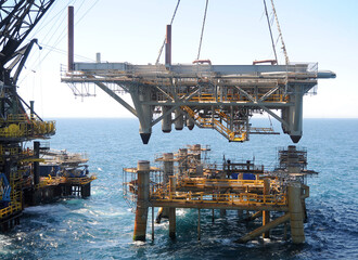 workers are transported to the topside section of an offshore platform lowered onto the jacket section -Bass Strait -Australia