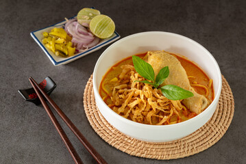 Northern Style Curried Noodle Soup with Chicken, Thai khao soi recipe, Traditional food of Chiang Mai