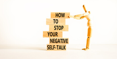 Stop negative self-talk symbol. Concept words Stop to flip your negative self-talk typed on blocks....