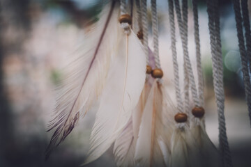 Dreamcatcher with feathers threads and beads rope hanging