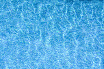 Clear refreshing water in swimming pool on sunny day, closeup