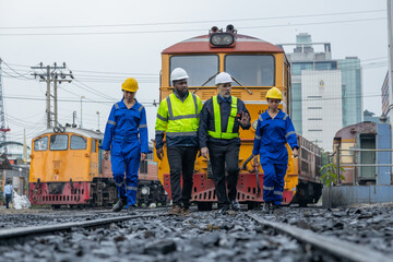 Railway engineer inspects diesel engine Report on the progress of engine parts in the factory. with...