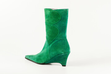 Female green leather boot on white background, isolated product.