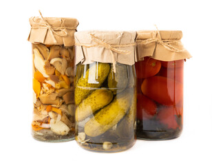 Jars with pickled vegetables. Marinated products. Assortment of homemade jars with various pickled...