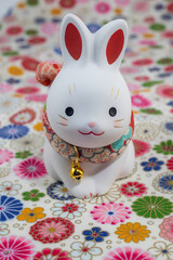 年賀状素材　ウサギの置物と和柄の敷物