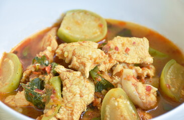 spicy boiled chicken with eggplant in curry soup on bowl