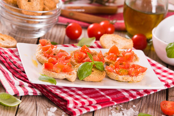 Friselle with cherry tomatoes and basil.