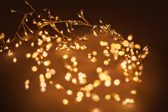 Christmas golden lights Background. Abstract twinkled bright bokeh defocused lights.