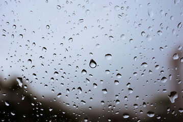 raining on the glass off window background