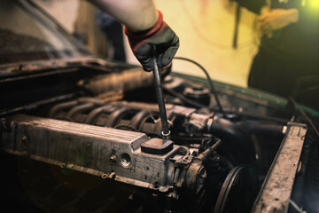 car engine repair and maintenance, valve cover unscrewing
