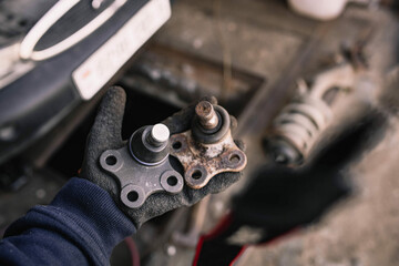 ball joint of the wheel hub of the car, the hinge attachment to the suspension arm, the concept of replacing the ball joint.