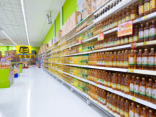 Supermarket concept Shopping cart and blurry picture
