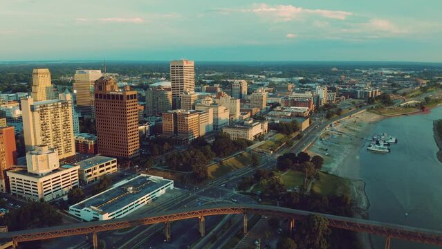 Aerial drone view of downtown Memphis from over the Mississippi River in the evening