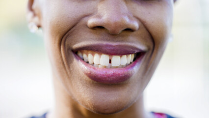 Fototapeta premium Close up shot of young lady mouth with a slight gap in her teeth