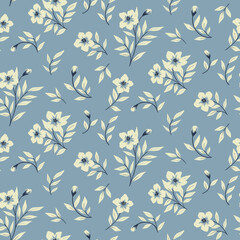 Seamless floral pattern, modern folk style ditsy print with winter botany: small white flowers on branches, leaves on a blue background. Beautiful flower surface design, vector botanical illustration.