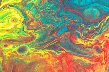 Abstract background from flowing colored liquid paints