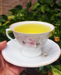 Beautiful Traditional Porcelain Cup of Chamomile Tea for relaxation. Powerful antioxidant tea full of health benefits.