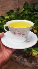 Beautiful Traditional Porcelain Cup of Chamomile Tea for relaxation. Powerful antioxidant tea full of health benefits.