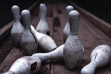 Closeup of dirty broken bowling pins outdoors at Pavliani park in Greece