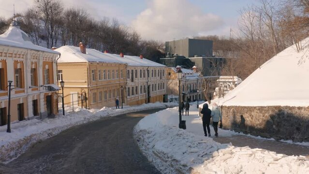 Winter walk after heavy snowfall on the european street. Andrews Descent in Kiev.