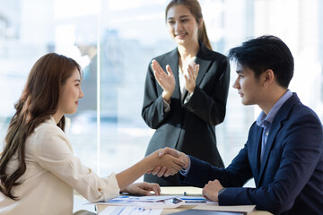 Handshake, Business partners meeting discussing cooperation agreements on business projects. Collaboration of people in the organization.