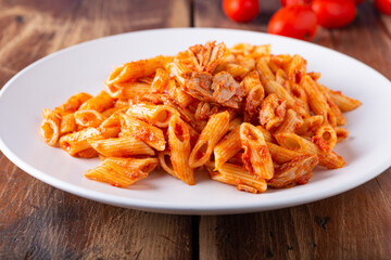 Pasta with tuna in tomato sauce, typical food of Mediterranean Italian cuisine.