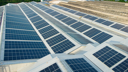 Footage over Solar cell on the roof of a large industrial factory. Solar roofs are generating renewable energy for the industry. The goal is to reduce the cost of electricity.