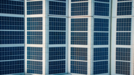 Footage over Solar cell on the roof of a large industrial factory. Solar roofs are generating renewable energy for the industry. The goal is to reduce the cost of electricity.