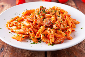 Pasta with tuna in tomato sauce, typical food of Mediterranean Italian cuisine.