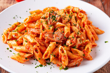 Pasta with tuna in tomato sauce, typical food of Mediterranean Italian cuisine.