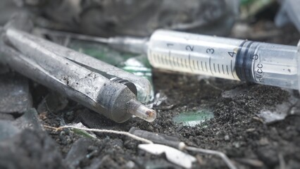 The syringes are in the trash