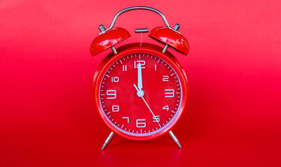 Red alarm clock on red background,with copy space