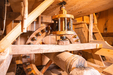 Wooden grinder with gears in a water mill as in the medieval or Viking times