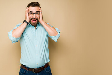 Surprised man shouting with happiness and looking excited