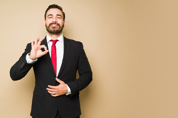 Successful businessman doing a perfect gesture