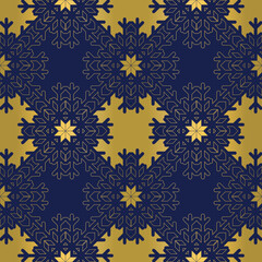 Regular seamless snowflake texture on blue background. Elegant gold foil vector pattern for banners, greeting cards, Christmas and New Year cards, invitations and paper packaging.