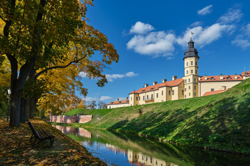 View of belorussian tourist attraction - Nesvizh castle in autumn landscape. Nesvizh, Minsk region, Belarus.