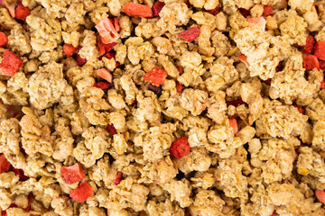 Strawberry Granola flat lay on a pink paper surface
