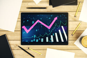 Abstract creative financial graph with upward arrow on modern digital tablet monitor, forex and...