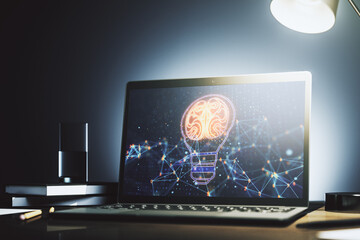 Creative idea concept with light bulb and human brain illustration on modern laptop screen. Neural...