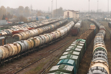 Freight wagons in railway. Dead end on railway station with cargo wagons and cisterns. Sorting station with freight trains