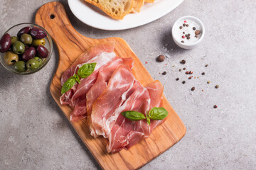 Closeup of thin slices of prosciutto. Italian food 
