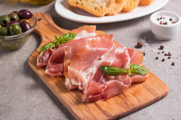 Closeup of thin slices of prosciutto. Italian food 