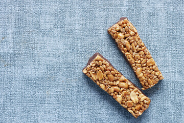 Almond , Raisin and oat protein bars on table 