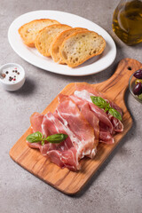 Closeup of thin slices of prosciutto. Italian food 