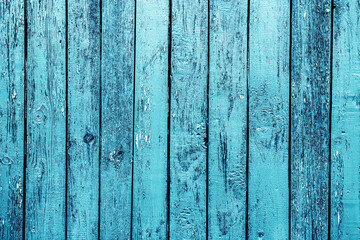Fototapeta na wymiar Wooden desk background. Peeling paint pattern. Old peeling paint texture. Grunge cracked wall background. Blue color weathered surface. Broken wood structure. Vintage pattern design.