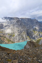 Limmerensee reservoir surrounded by Muttenchopf mountain and Muttsee mountain lake in Glarus, Switzerland