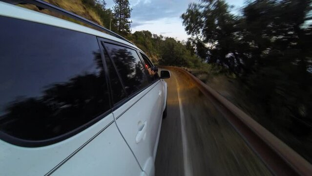 Point Of View Time Lapse Man Driving Car While Exploring On Vacation From Day To Evening - Yosemite, California