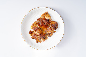 Fresh pan-fried chicken chops on a monochrome background