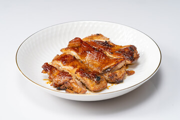 Fresh pan-fried chicken chops on a monochrome background